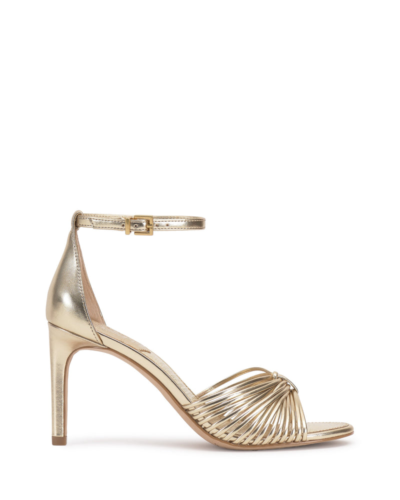 The Blaine Sandal by Vince Camuto features a gold hue, multiple thin crossing straps, an ankle strap with buckle closure, an open toe, and a slender mid-height heel for added elegance.