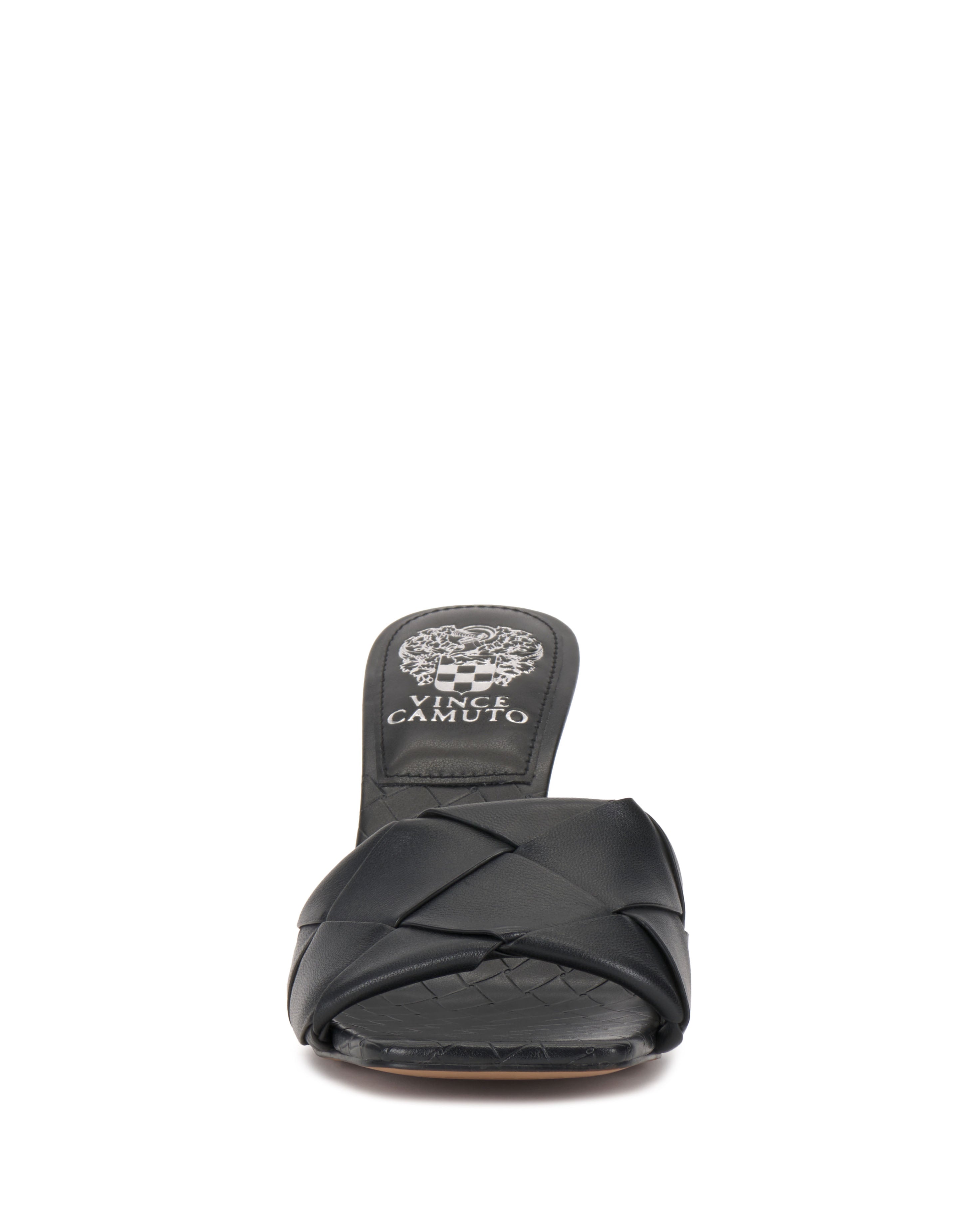 Front view of the Vince Camuto Brelanie Woven Mule, a black slip-on sandal featuring a woven leather strap, open toe, and Vince Camuto branding on the insole.