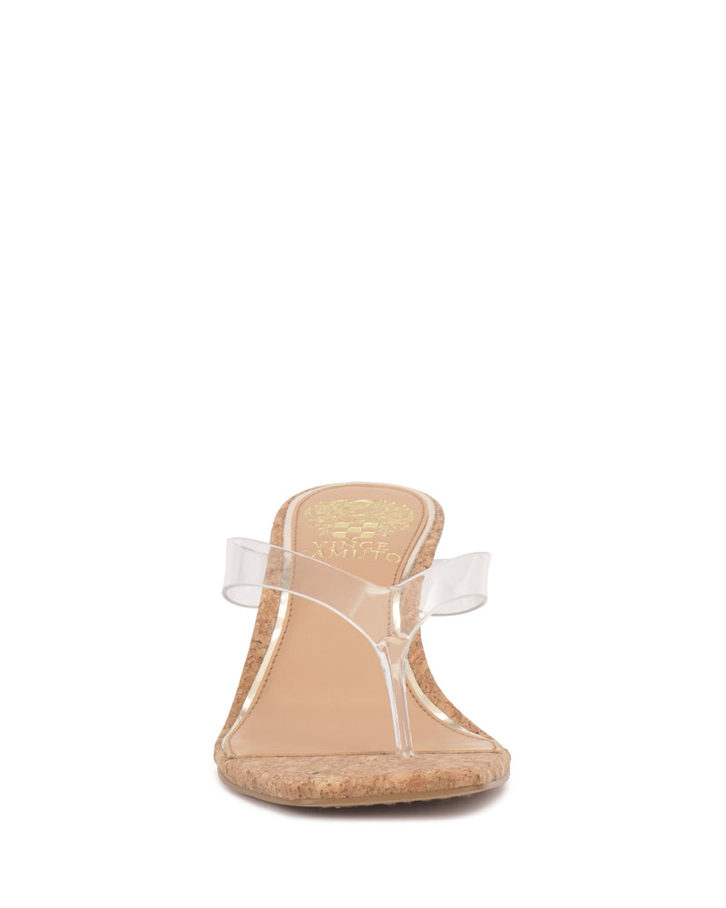 Front view of the Cianna Wedge Sandal by Vince Camuto, featuring a cork sole with subtle details and two clear lucite straps. The tan footbed stands out against a crisp white background.