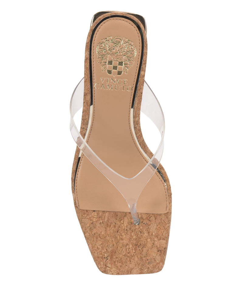 The Cianna Wedge Sandal by Vince Camuto features a cork platform sole, tan footbed, clear lucite toe strap, and a gold Vince Camuto logo with crest on the insole.