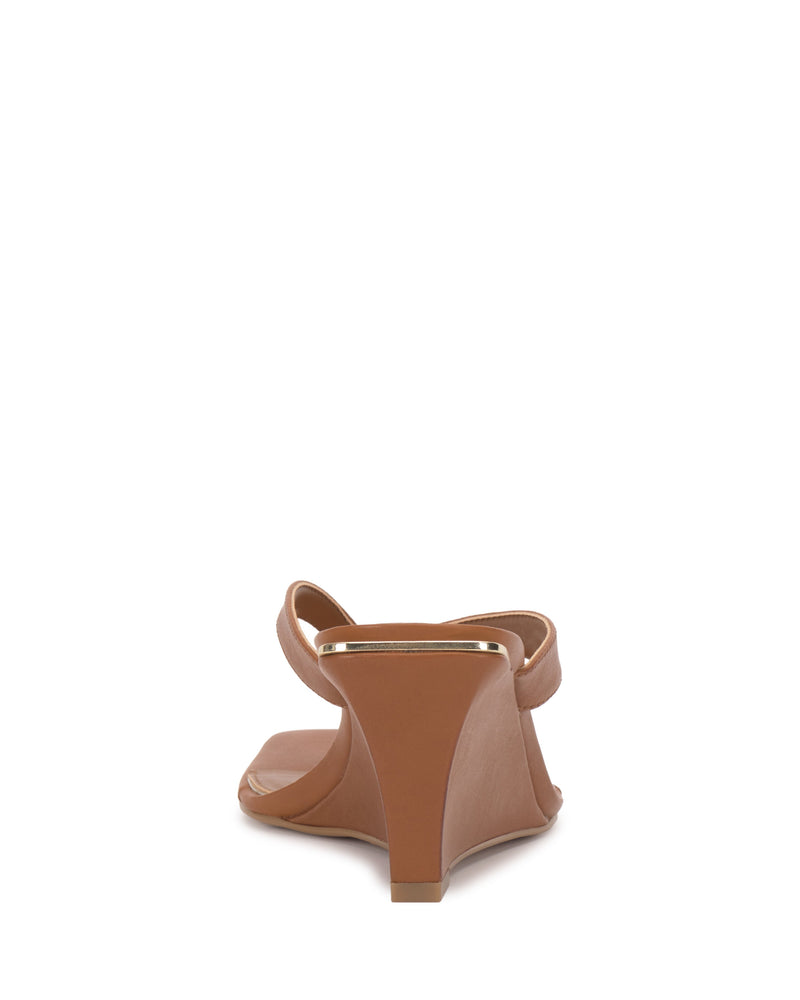 A rear view of a single tan Vince Camuto Cianna Wedge Sandal with an open toe, thin front strap, and wedge heel, displayed on a plain white background.