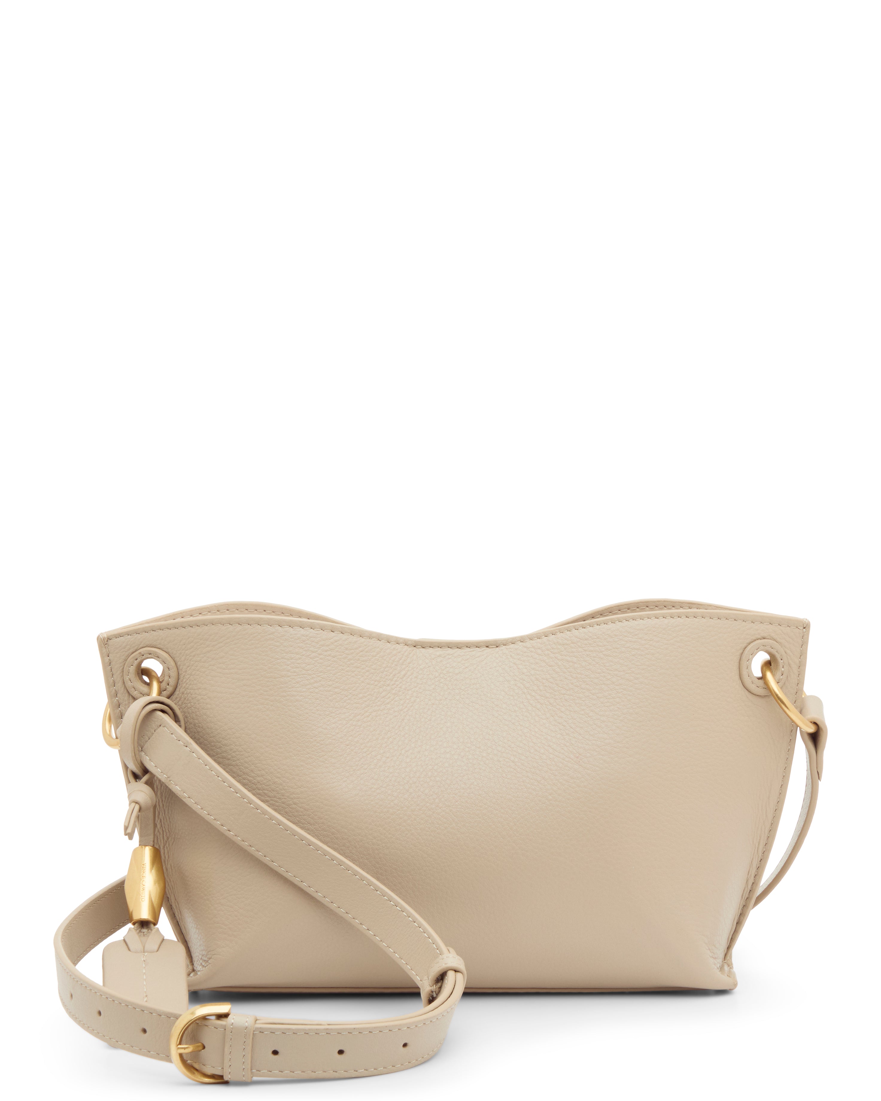 The Vince Camuto Ellah Crossbody Bag is a beige leather bag featuring a wavy top edge, gold hardware, and an adjustable strap, shown against a white background.