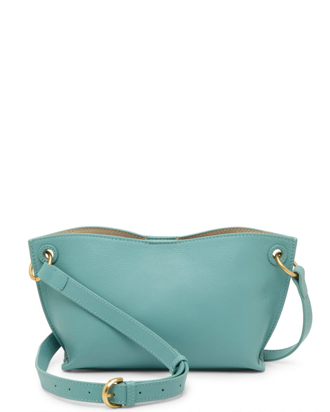 The Vince Camuto Ellah Crossbody Bag features a small, light blue leather body, gold-tone hardware, an adjustable strap, and a simple curved design.