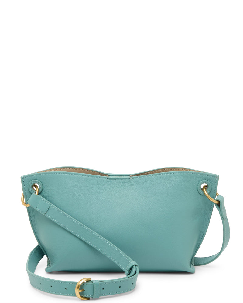 The Ellah Crossbody Bag by Vince Camuto is a small, light blue leather crossbody with gold hardware, adjustable strap, and grommet details on each side. Displayed on a white background.