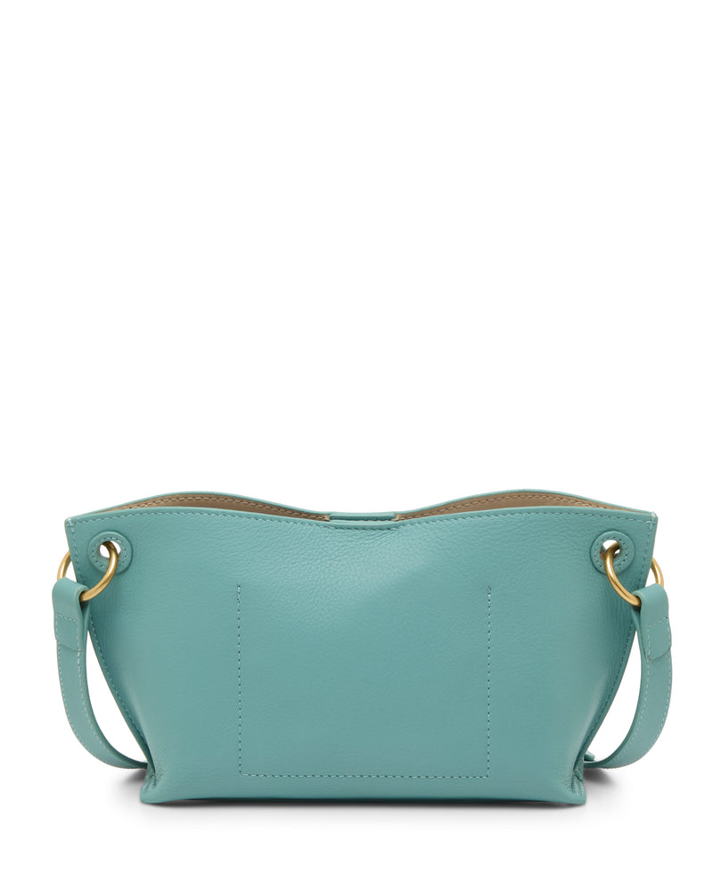 The Ellah Crossbody Bag by Vince Camuto is a small, light blue leather bag with gold hardware, a short strap, curved top edge, minimal stitching, and a simple, elegant design.