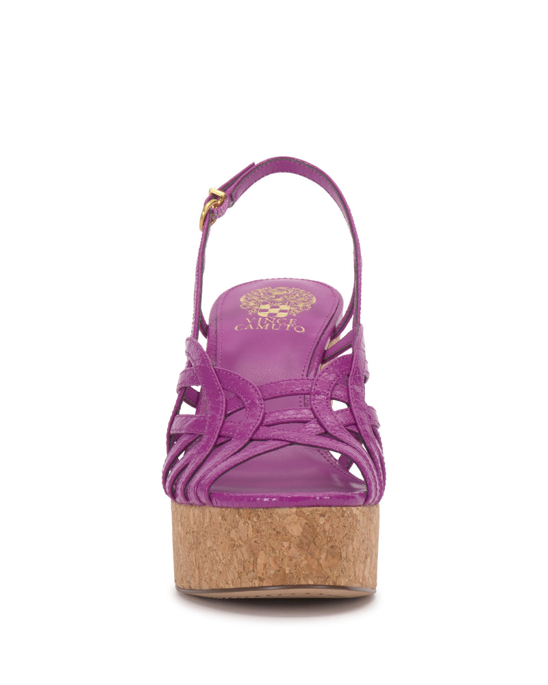 Front view of the Vince Camuto Elody Wedge Sandal in purple, showcasing crisscross straps, a cork platform wedge, slingback with gold buckle, and a gold logo on the insole.