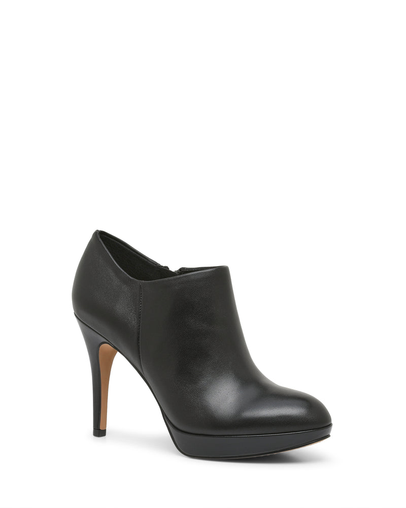 The Elvin Bootie by Vince Camuto is a black leather high-heeled shoe with a closed toe and slim heel, displayed on a white background. This ankle bootie features a smooth finish and a slight platform sole for enhanced comfort and style.