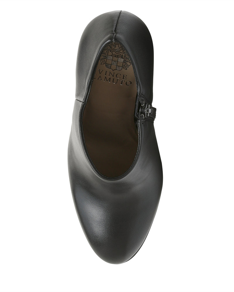 A single Vince Camuto Elvin Bootie in black leather is shown from above, displaying a side zipper and the Vince Camuto logo on the insole.