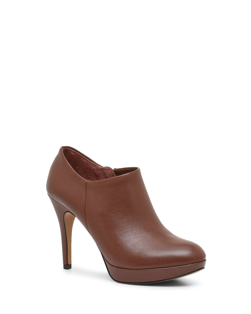 The Elvin Bootie by Vince Camuto features a brown smooth leather finish, closed toe, sky-high heel, and ankle height, displayed on a white background.