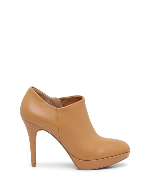 The Elvin Bootie by Vince Camuto is a tan, high-heeled ankle bootie featuring a closed toe and a slight platform sole, displayed from the side against a white background.