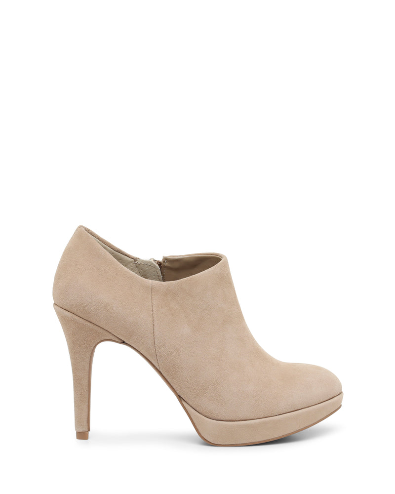 The Vince Camuto Elvin Bootie, a beige suede ankle bootie with a rounded toe and platform sole, features a sky-high heel and is shown in profile on a white background.