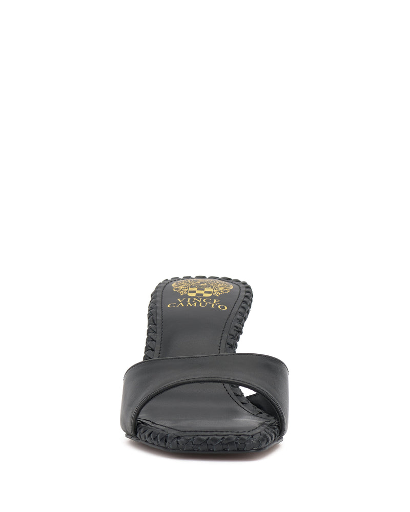 Front view of the Vince Camuto Emmla Mule, a black open-toe slide with a wide strap, textured sole, gold branding on the insole, and braided midsole details for a touch of modern elegance.