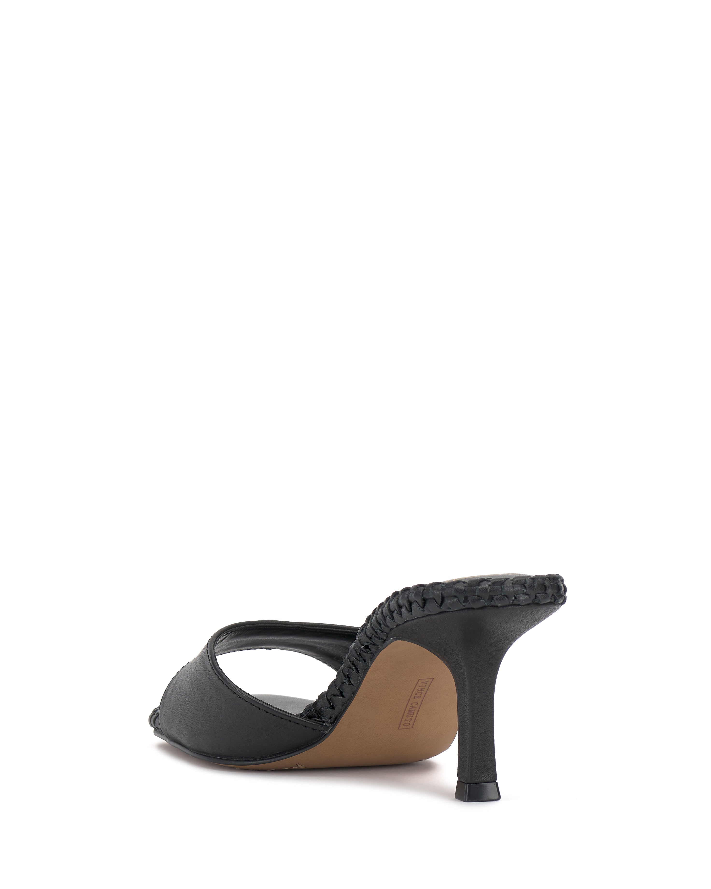 The Vince Camuto Emmla Mule is a black heeled sandal with a woven edge detail, open heel design, slim mid-height heel, and smooth minimalist upper for a modern, elegant look.