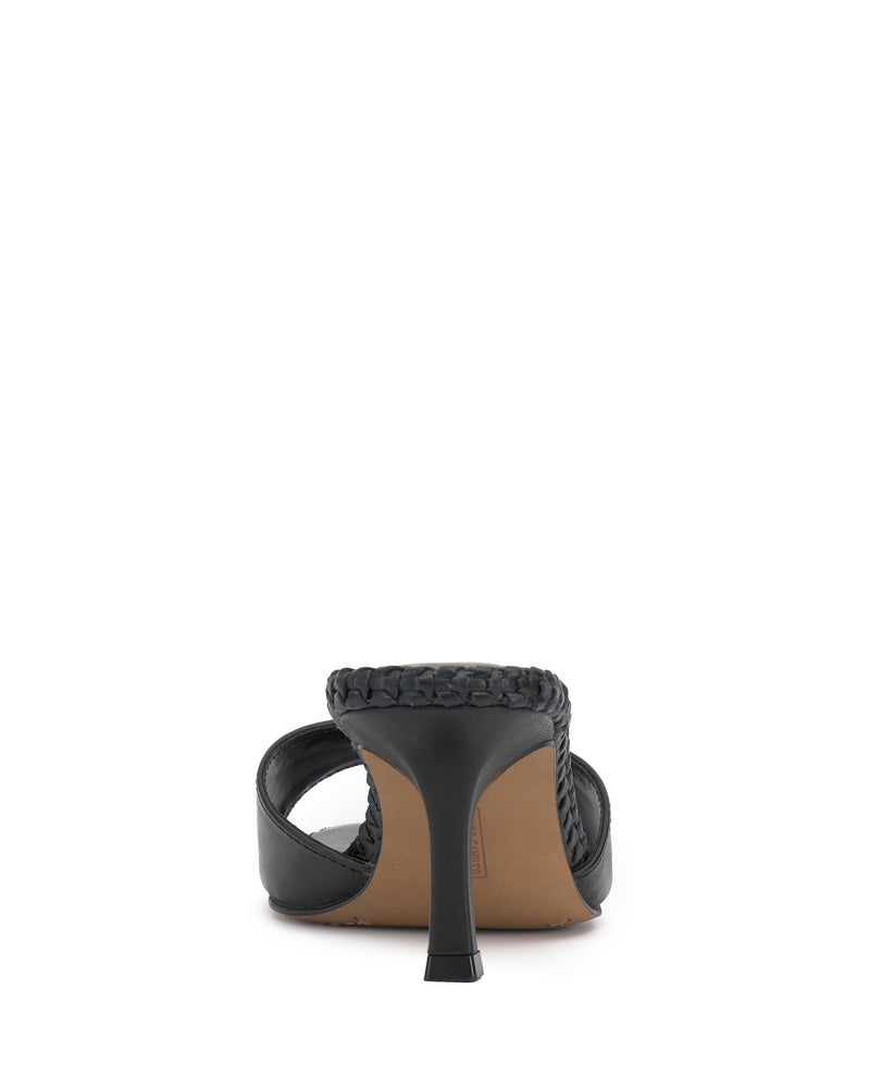 A back view of the Vince Camuto Emmla Mule highlights modern elegance with its black high heel, braided strap design, and tan insole against a white background.