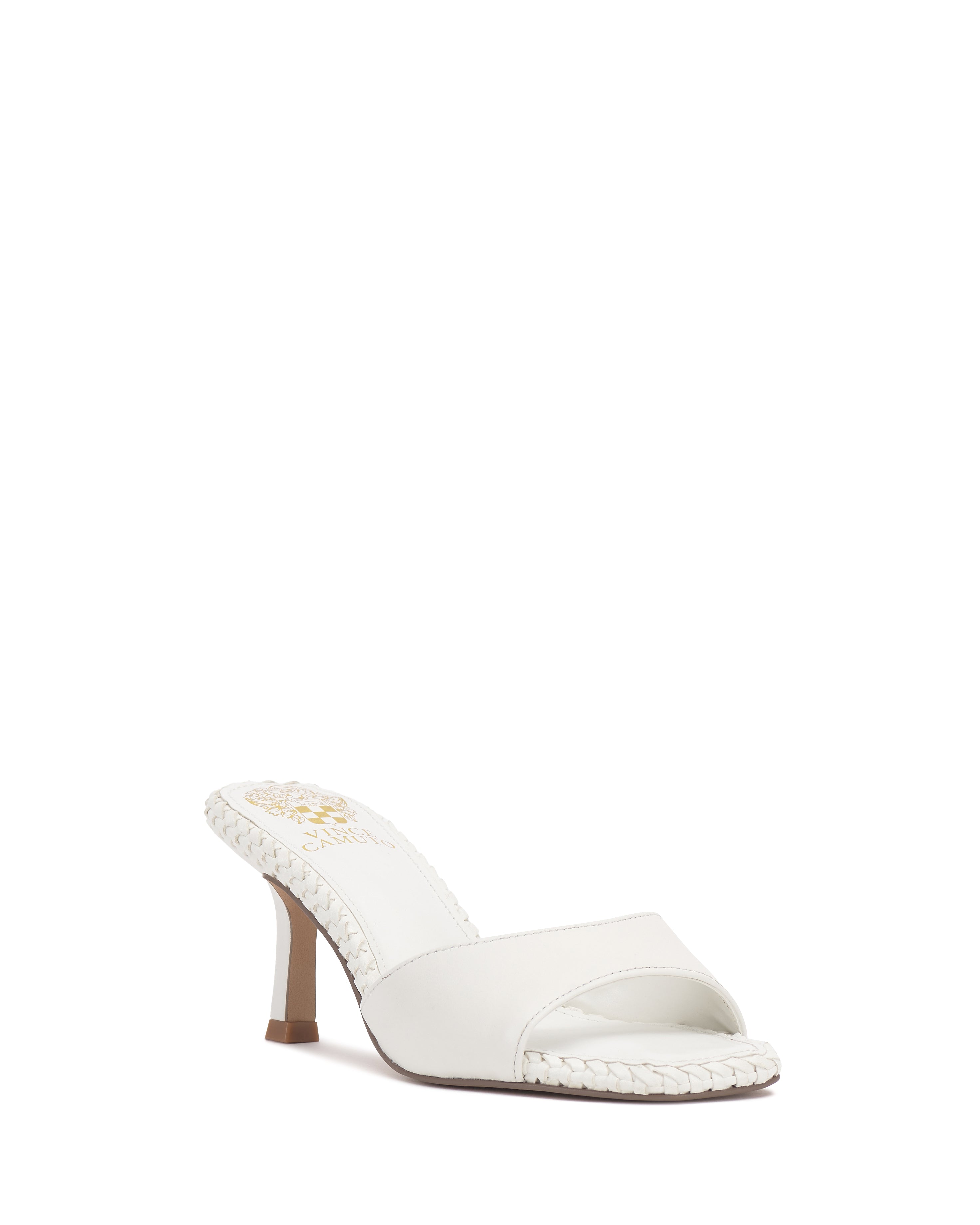 The Emmla Mule by Vince Camuto is a modern, elegant white open-toe heel with a braided trim and a wide front strap, delivering stylish and trendy women's footwear.