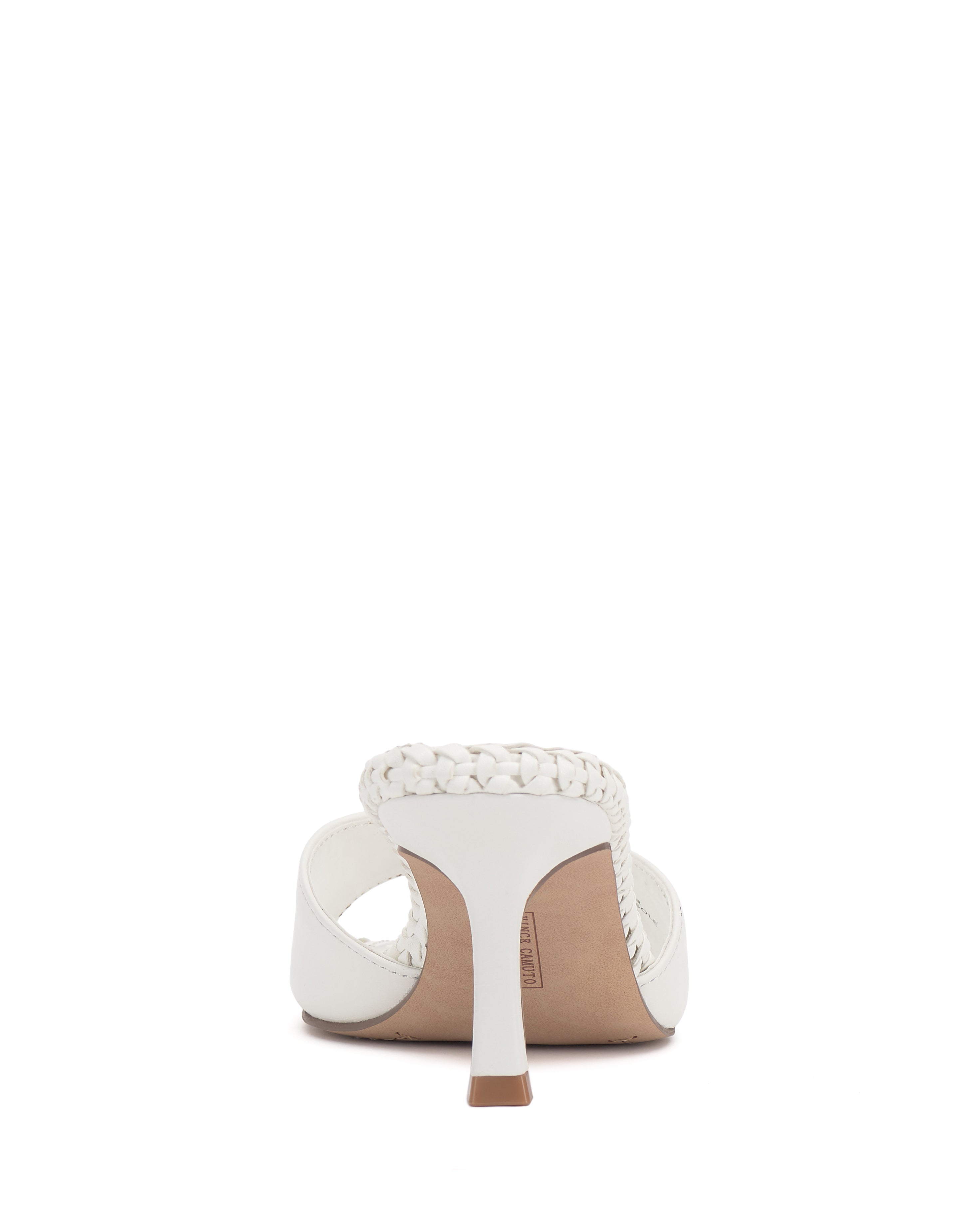 The Emmla Mule by Vince Camuto is a modern white sandal with a braided strap, slim high heel, and contrasting tan insole, displayed from the back against a plain white background for a chic look.