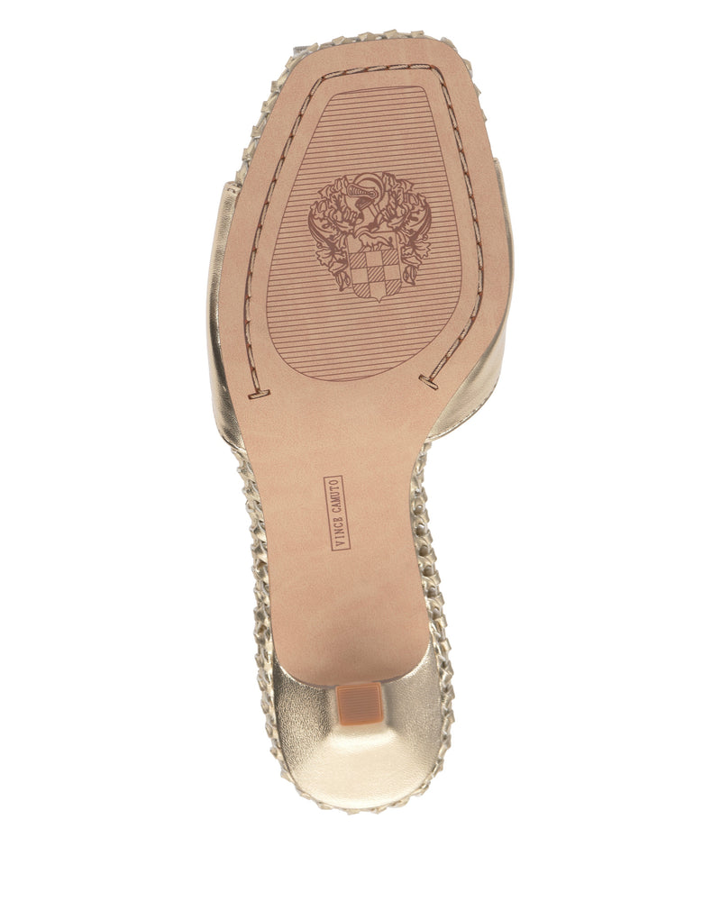 The Emmla Mule by Vince Camuto features a textured-edge sole with a decorative embossed crest and a Made in Italy stamp on the tan underside—a perfect blend of modern elegance.