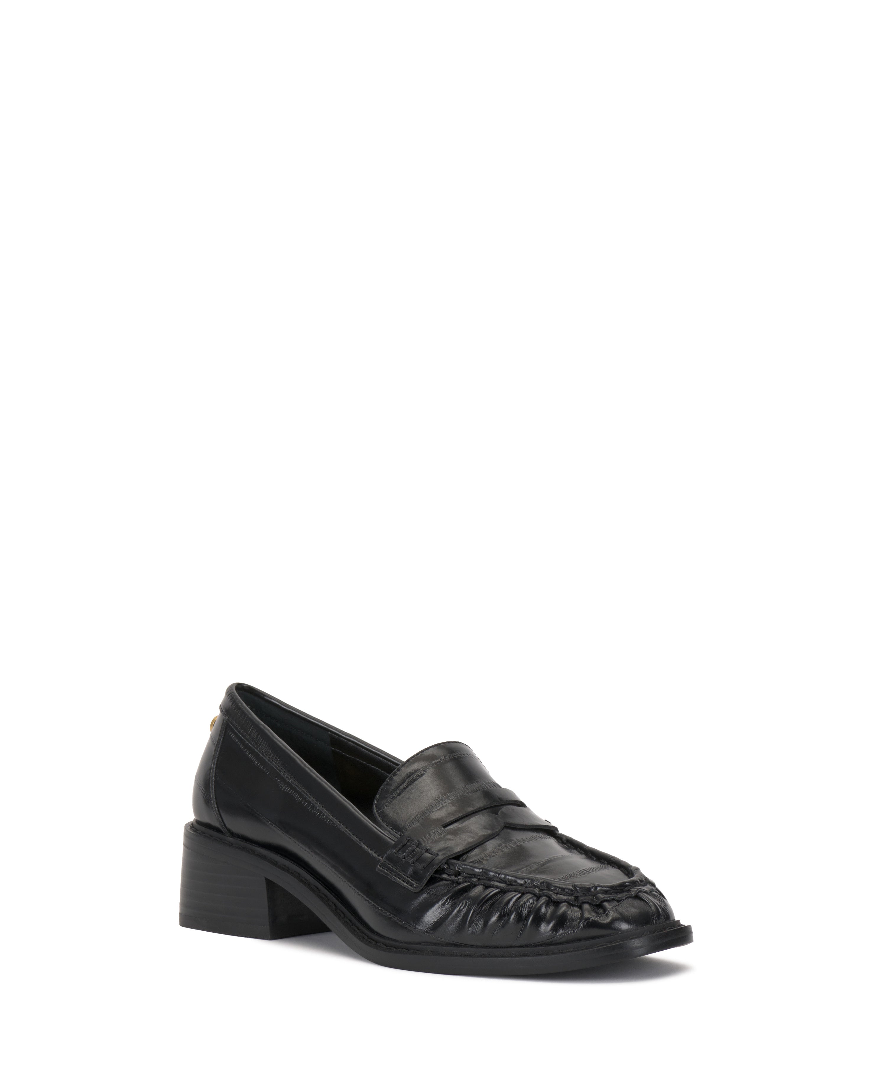 The Vince Camuto Eshnie Block Heel Loafer showcases black leather with a low block heel, rounded toe, and stitched front detail, shown on a white background.