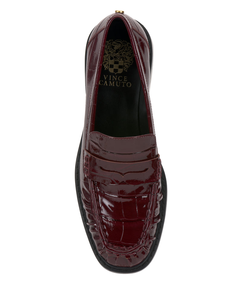 Top view of the Vince Camuto Eshnie Block Heel Loafer in dark red with crocodile-embossed texture, black sole, and a gold Vince Camuto logo on the insole.