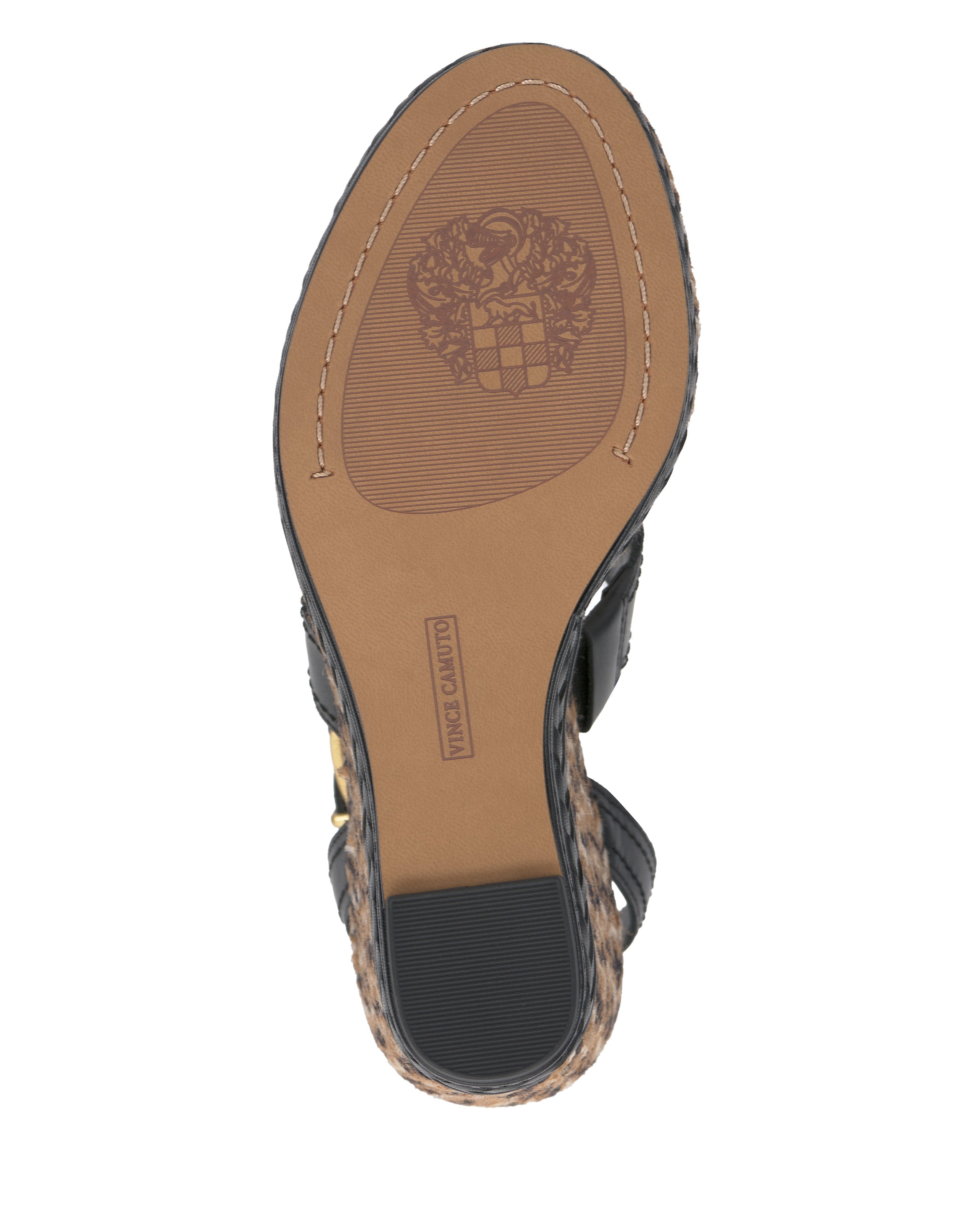 The image shows the sole of the Vince Camuto Esmia Espadrille Wedge Sandal featuring a textured pattern, a crest design near the ball of the foot, and "Vero Cuoio" stamped at the center.