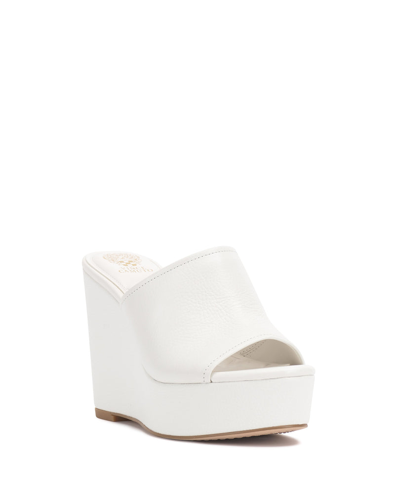 The Vince Camuto Etta Wedge Sandal is a Y2K-inspired white platform with an open toe and single leather band, shown on a plain white background.