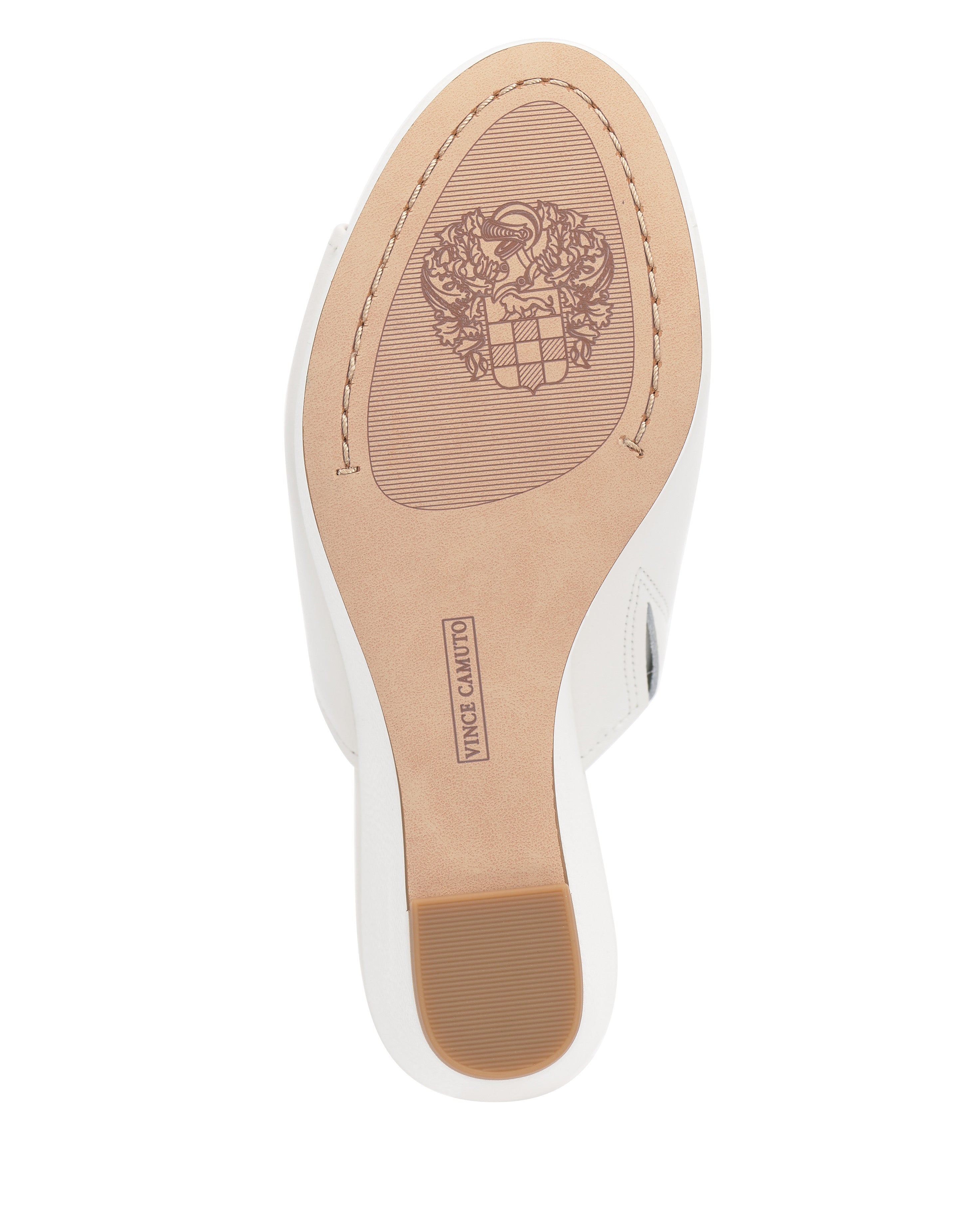 The image shows the tan bottom sole of the Vince Camuto Etta Wedge Sandal, featuring an engraved crest, a rectangular logo, and a textured heel—ideal for pairing with Y2K-inspired outfits or single banded leather wedges.