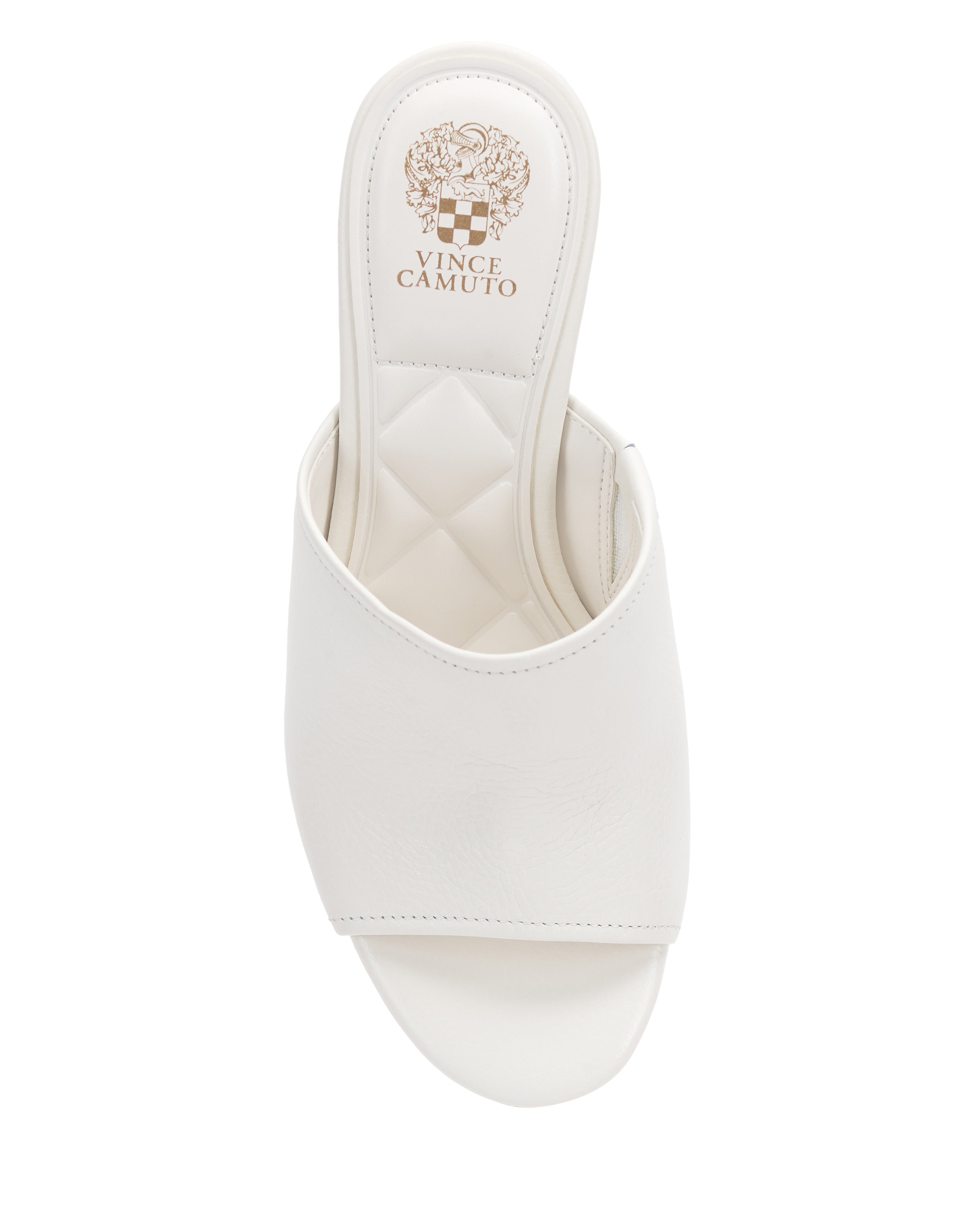 The Vince Camuto Etta Wedge Sandal is a white, open-toe slip-on with a single band, quilted footbed, leather wedge heel, and the Vince Camuto logo on the insole.