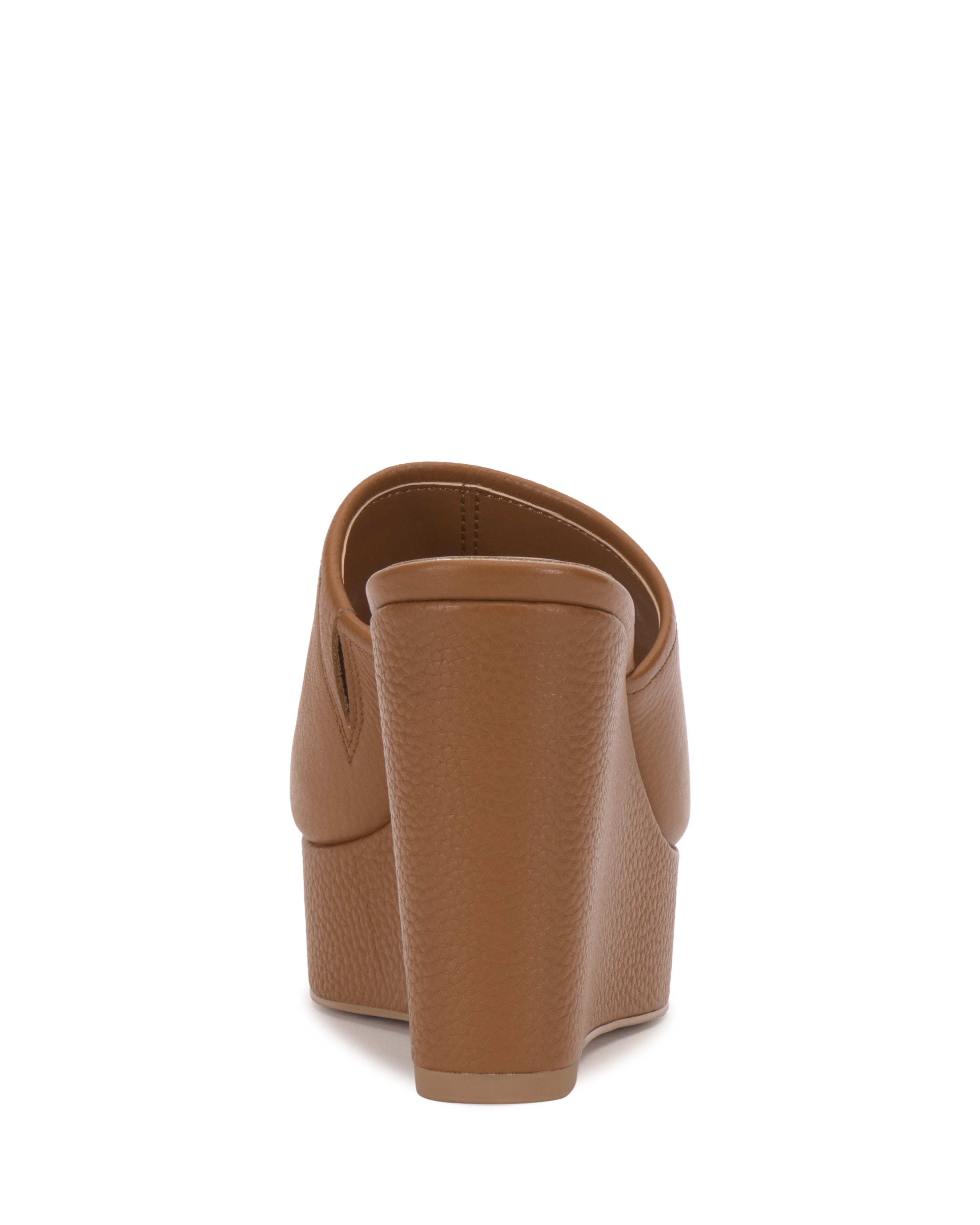 Back view of the Vince Camuto Etta Wedge Sandal in brown, featuring a single band, closed heel, and textured material, displayed against a white background.