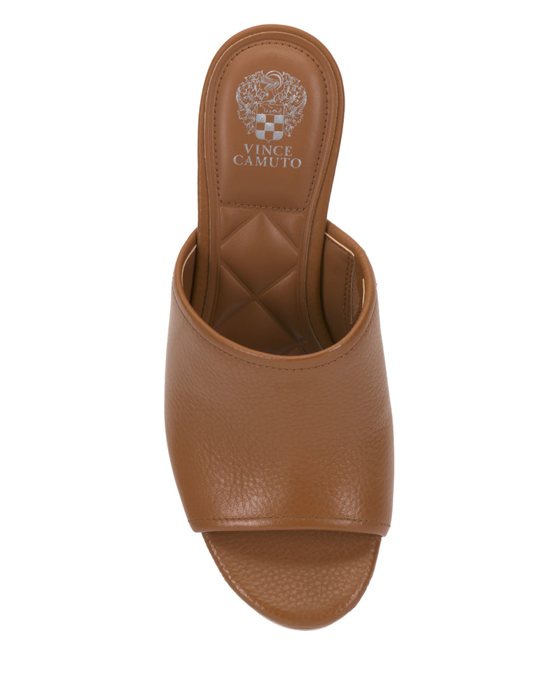 Top view of the Vince Camuto Etta Wedge Sandal, featuring a textured brown leather single band, open toe, quilted insole, and a subtle leather wedge heel inspired by Y2K style.