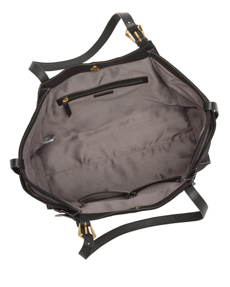 The Vince Camuto Faey Tote Bag features an open black design with a grey fabric lining, an interior zippered pocket, two small open pockets, and gold hardware on the handles and straps.