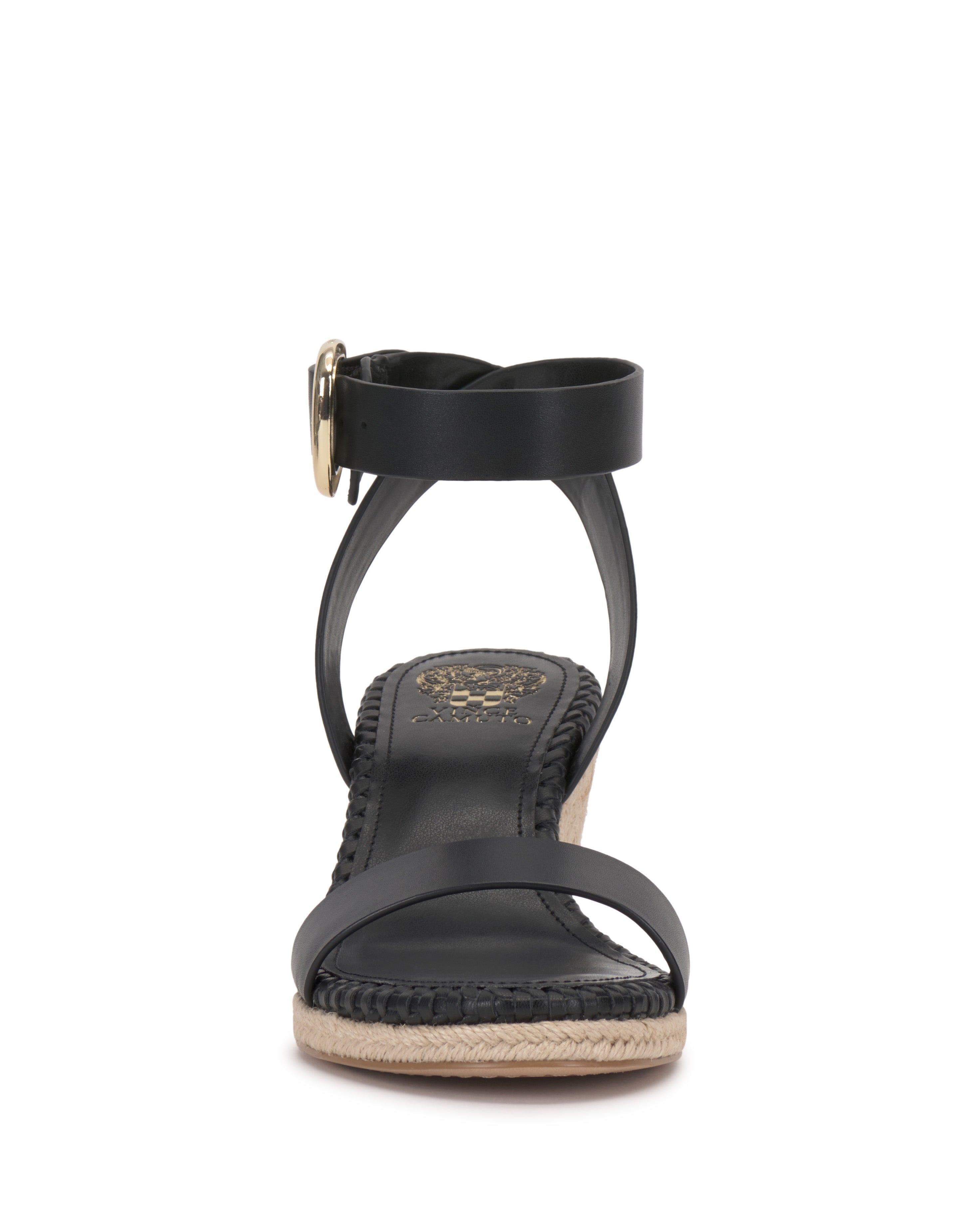 The Vince Camuto Fainel Espadrille Wedge Sandal features a black open-toe design with two straps, an ankle buckle, a cushioned insole, and a woven wedge heel for summery style.