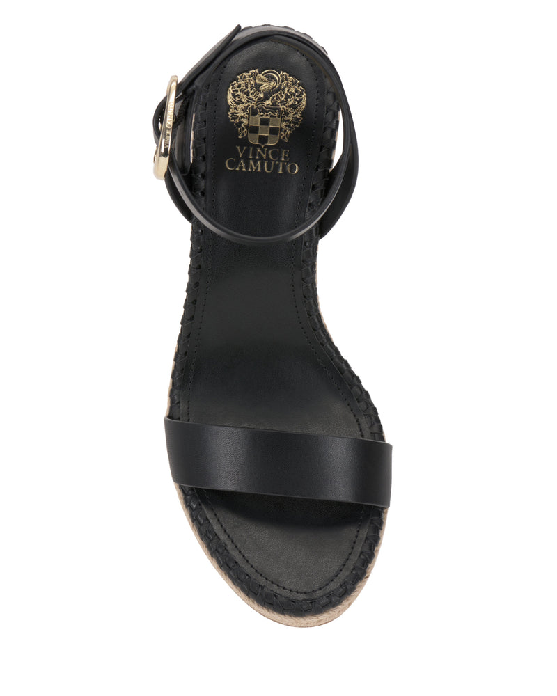 The Vince Camuto Fainel Espadrille Wedge Sandal features a black ankle strap with gold buckle, a single front strap, stitched edges, a lightly textured sole, and a gold brand logo on the insole for added summery style.