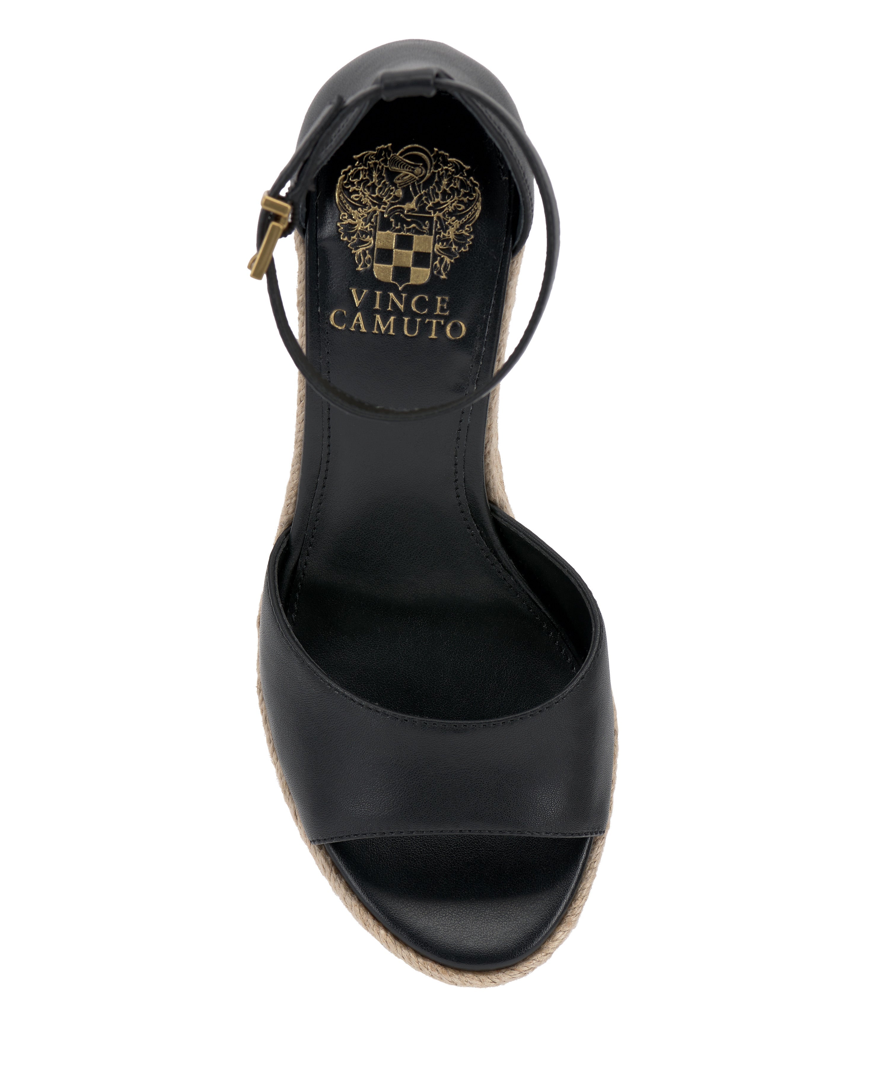 The Vince Camuto Felyn Espadrille Wedge Sandal in black features an open toe, ankle strap, gold insole logo, and a woven espadrille trim on the sole, shown from above.