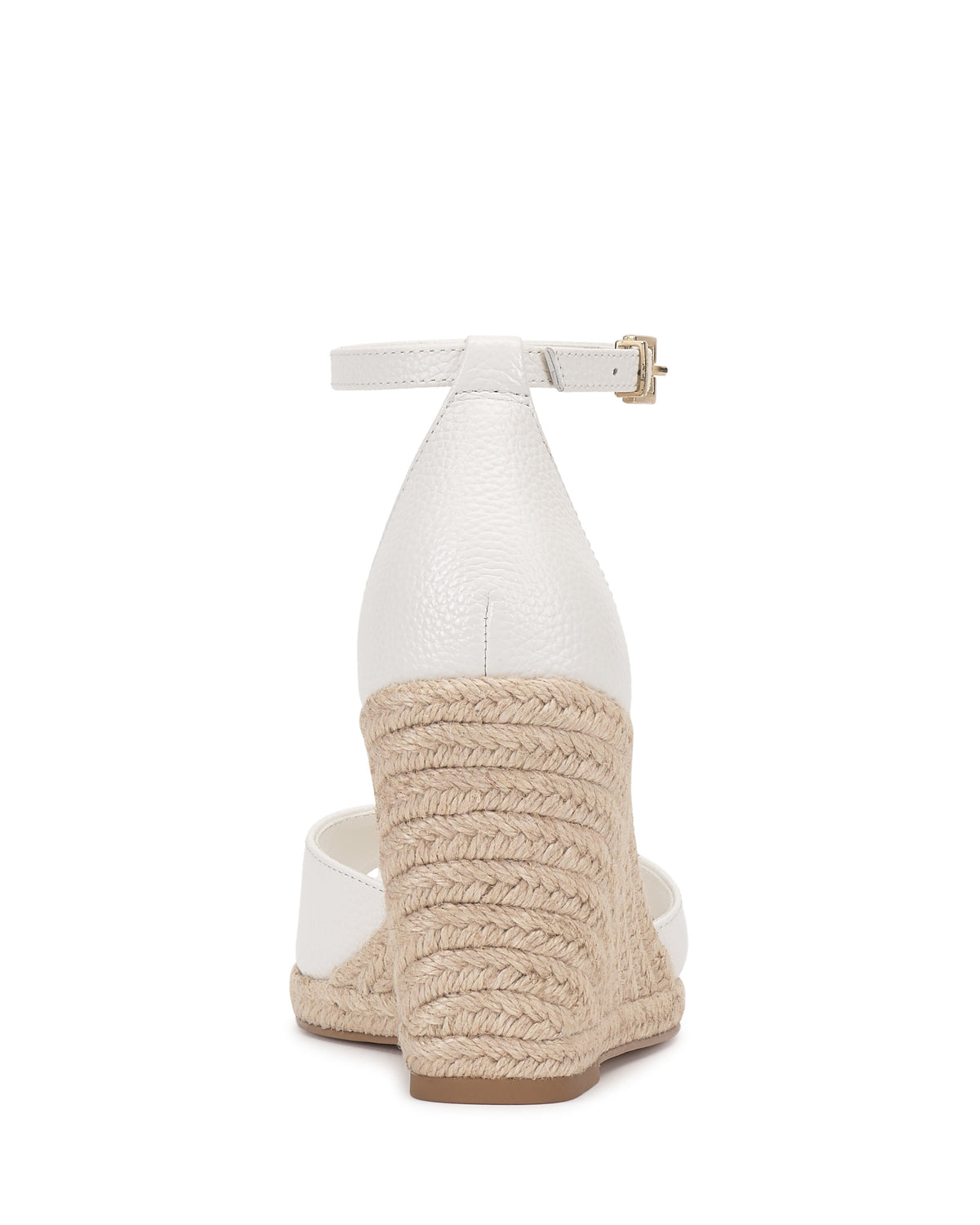 Rear view of the Vince Camuto Felyn Espadrille Wedge Sandal in white, featuring a textured leather upper, ankle strap with buckle closure, and woven jute wedge heel.