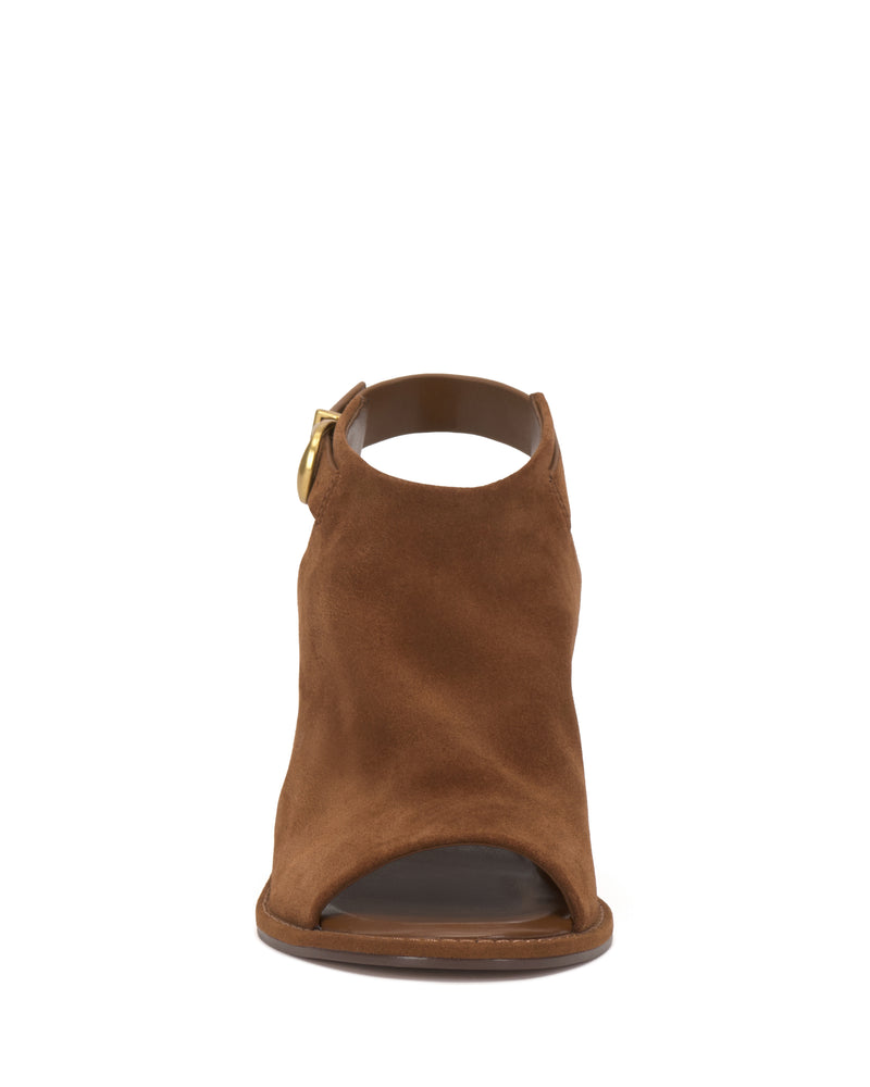 Front view of the Fezisha Sandal by Vince Camuto—a brown suede open-toe sandal with a gold side buckle and covered upper—displayed on a white background.