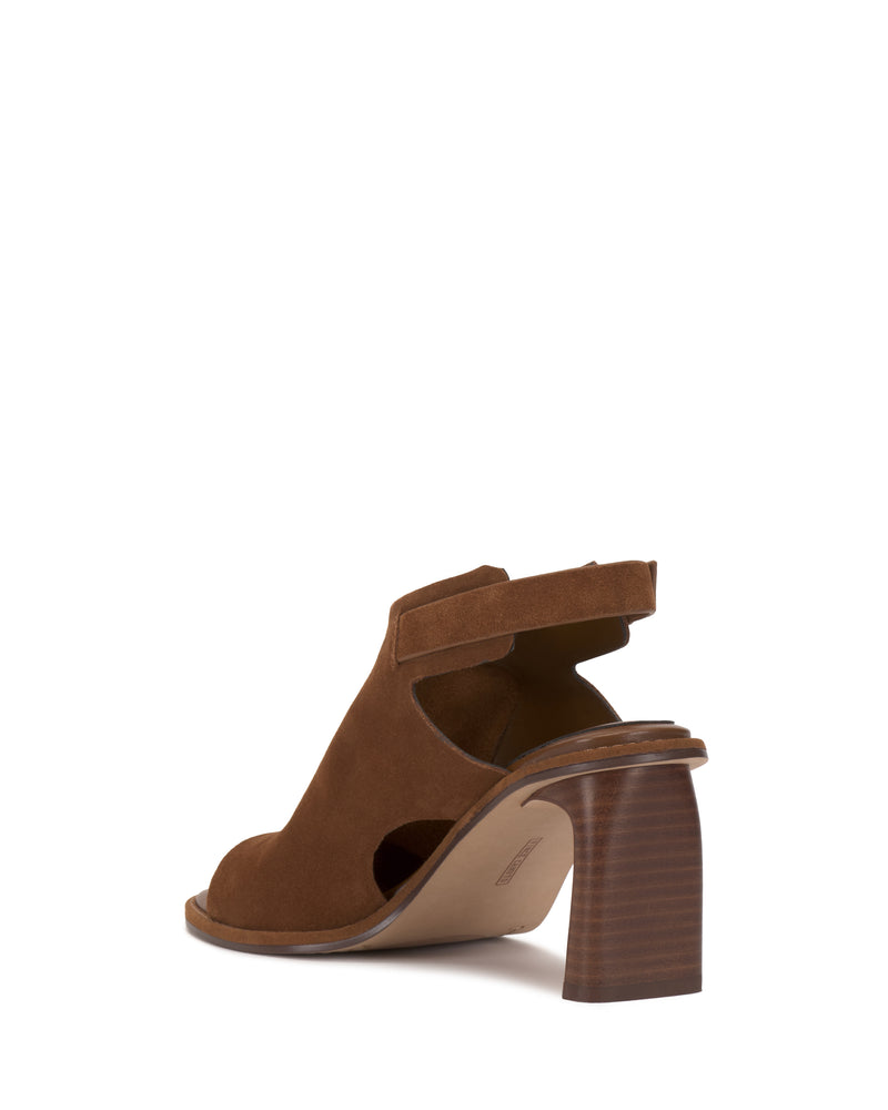 The Fezisha Sandal by Vince Camuto is a brown suede open-toe shoe with a thick stacked high heel and ankle strap, shown on a white background from the back angle.