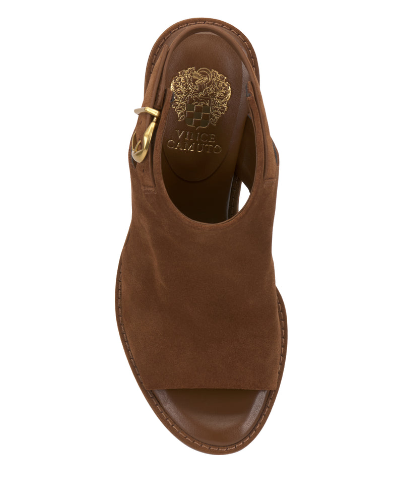 A top view of the Vince Camuto Fezisha Sandal in brown suede, featuring an open toe, gold side buckle, and Vince Camuto branding on the insole.
