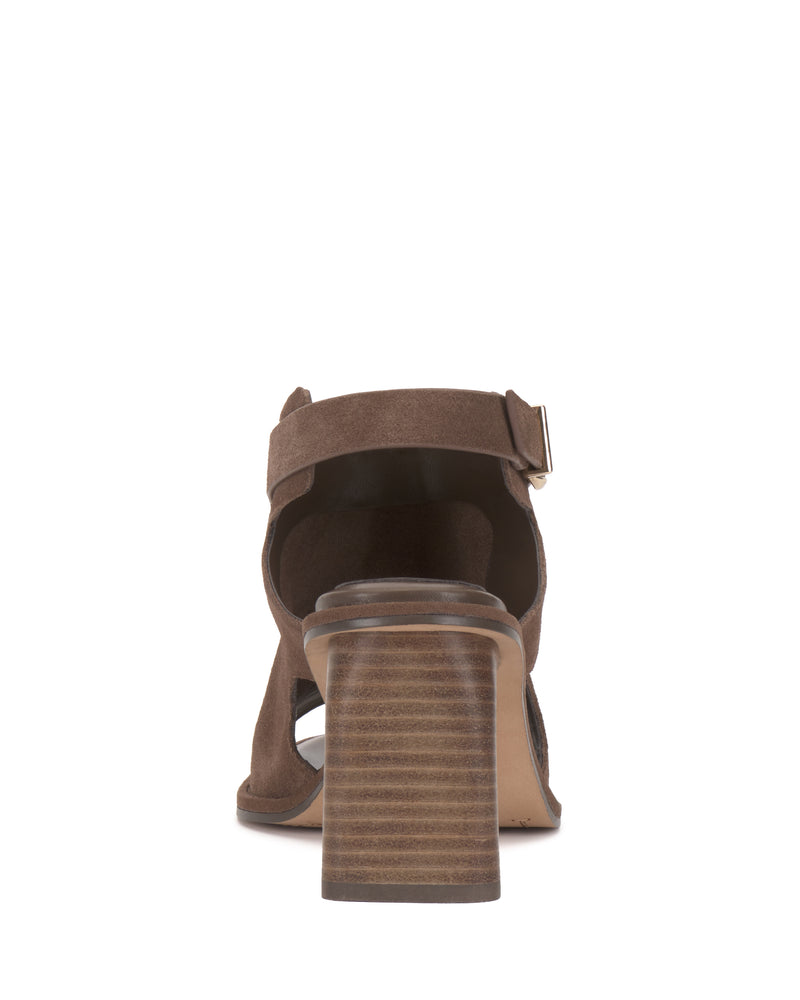 Rear view of the Vince Camuto Fezisha Sandal in brown suede, featuring a thick stacked block heel, ankle strap, and open heel design, displayed against a plain white background.