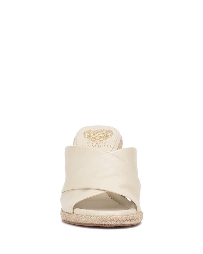 Front view of the Vince Camuto Fisella Espadrille Wedge Sandal, featuring cream-colored crisscross leather straps, an open toe, braided espadrille platform sole, and a convenient slip-on design.