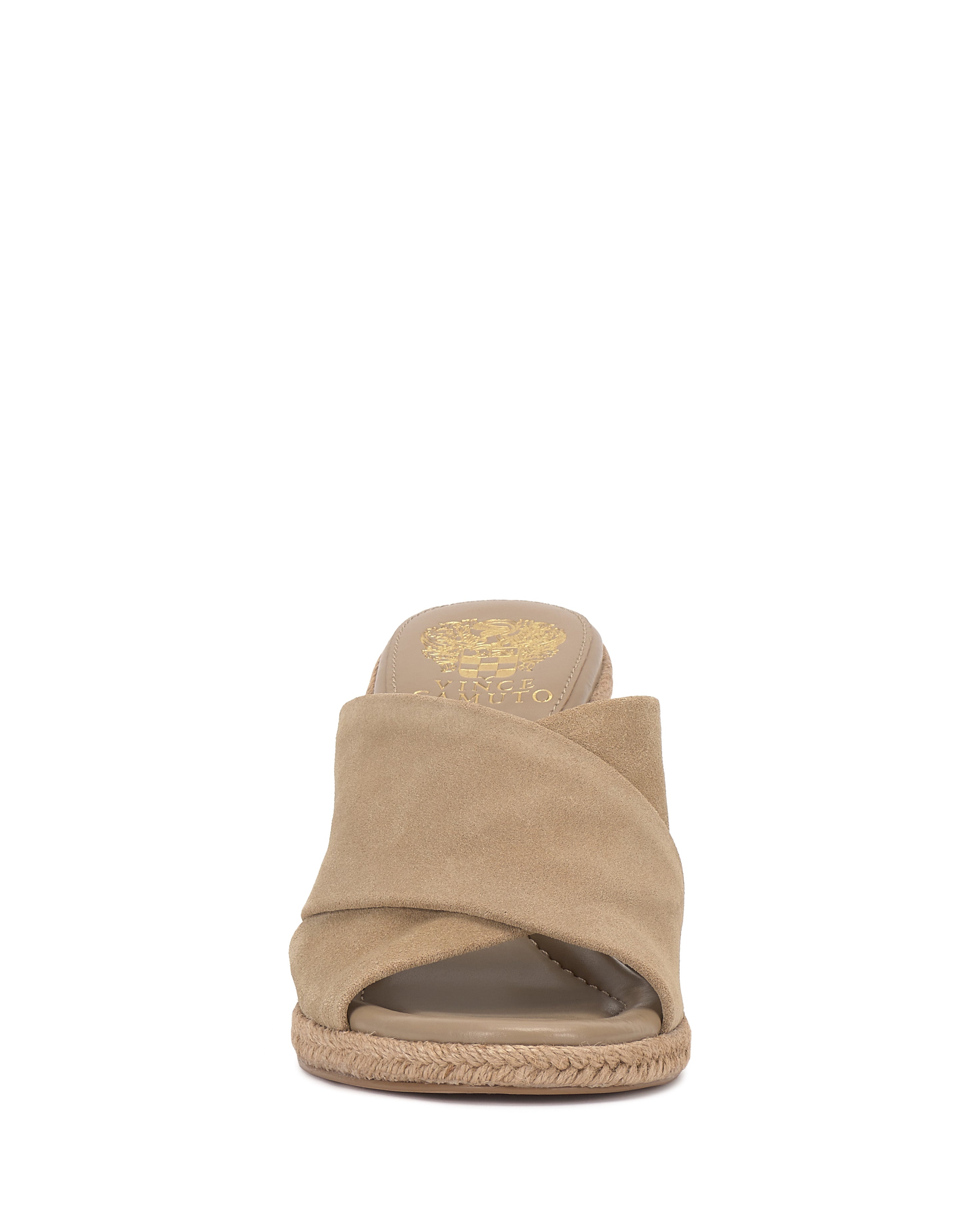 Front view of the Vince Camuto Fisella Espadrille Wedge Sandal in tan suede, featuring a crisscross slip-on design, open toe, braided sole detail, and gold brand logo on the insole.