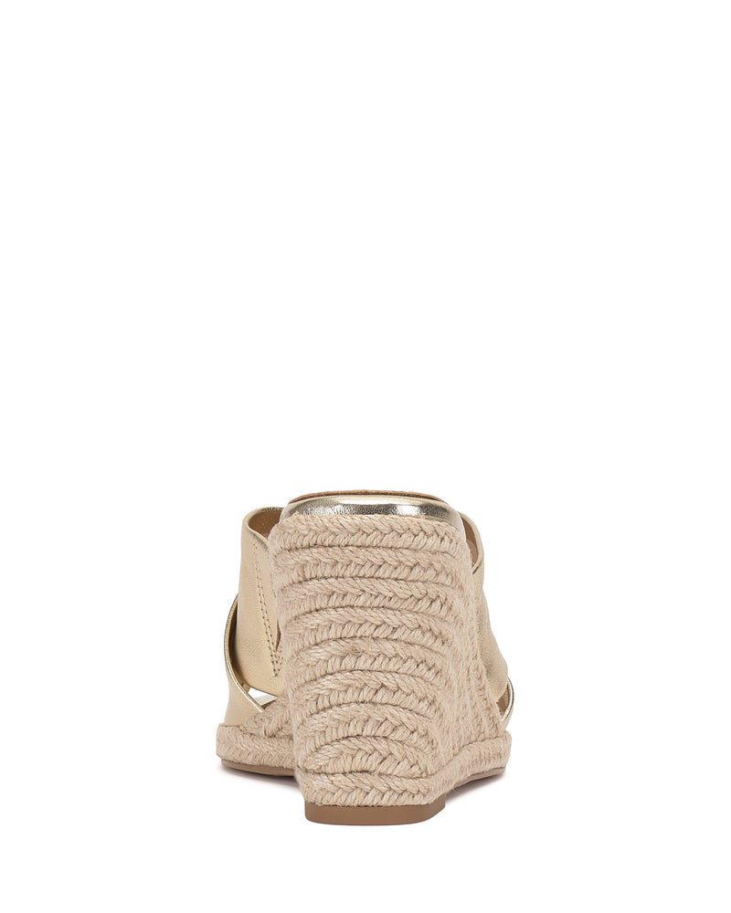 Rear view of the Vince Camuto Fisella Espadrille Wedge Sandal in beige, featuring a braided jute platform, peep-toe slip-on design, textured wedge, and metallic accent along the heel edge.