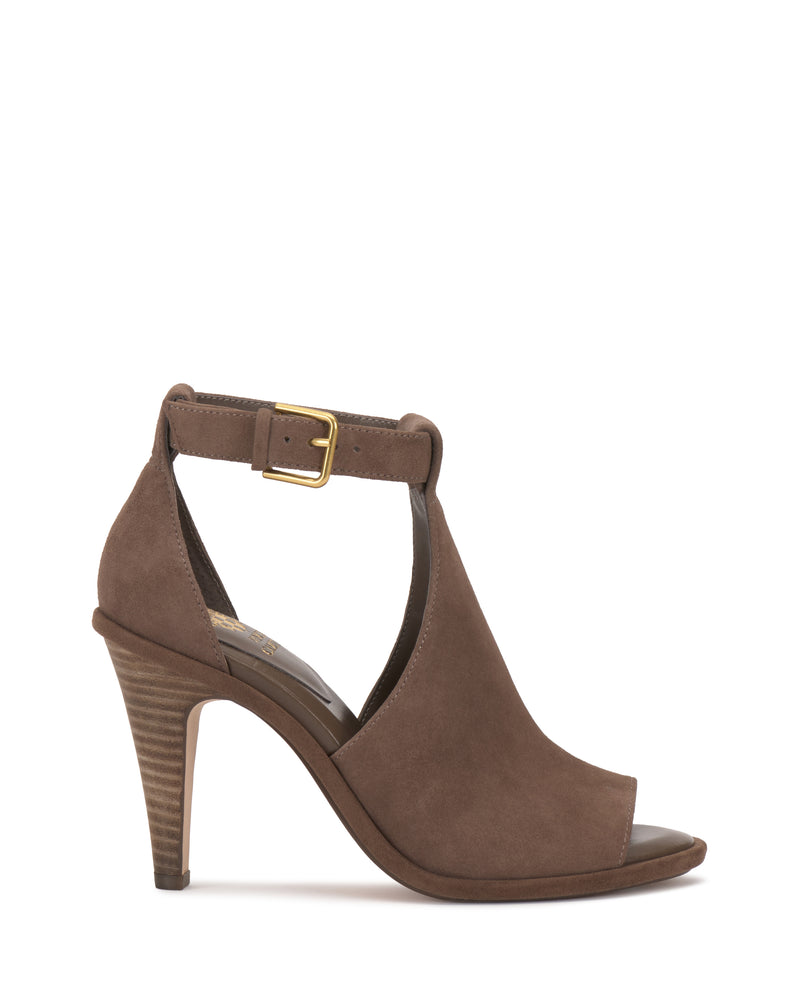 The Frasper Shootie by Vince Camuto is a brown suede high-heeled T-strap sandal featuring an open toe, open heel, ankle strap with gold buckle, cushioned footbed, and stacked wooden heel, displayed on a plain white background.