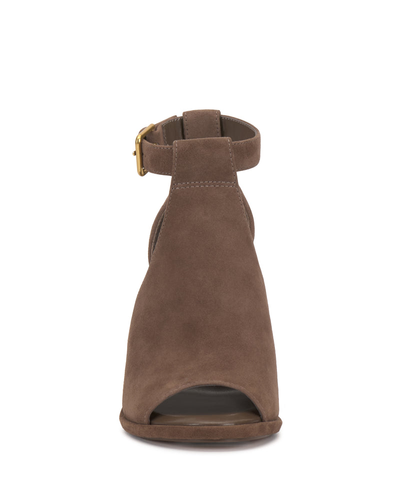 Front view of the Vince Camuto Frasper Shootie, a brown suede peep-toe sandal featuring a high heel, an ankle strap with a gold buckle, and a cushioned footbed for added comfort.