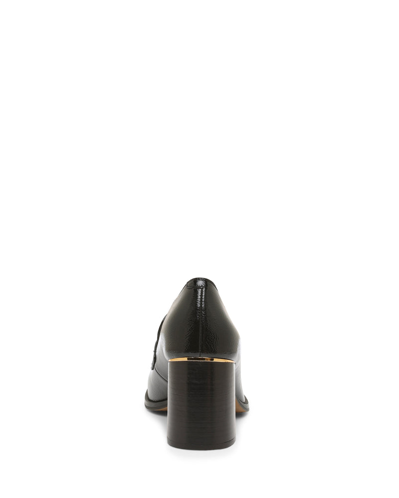 The Geanna Pump by Vince Camuto is a black heeled loafer viewed from the back, featuring a block heel with a gold accent near the sole. The glossy finish and classic design are highlighted against a white background.