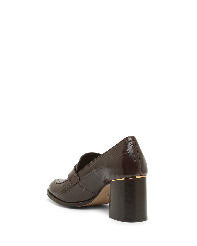 The Vince Camuto Geanna Pump is a dark brown, textured leather loafer with a rounded toe and a chunky block heel, shown from the back side on a white background.