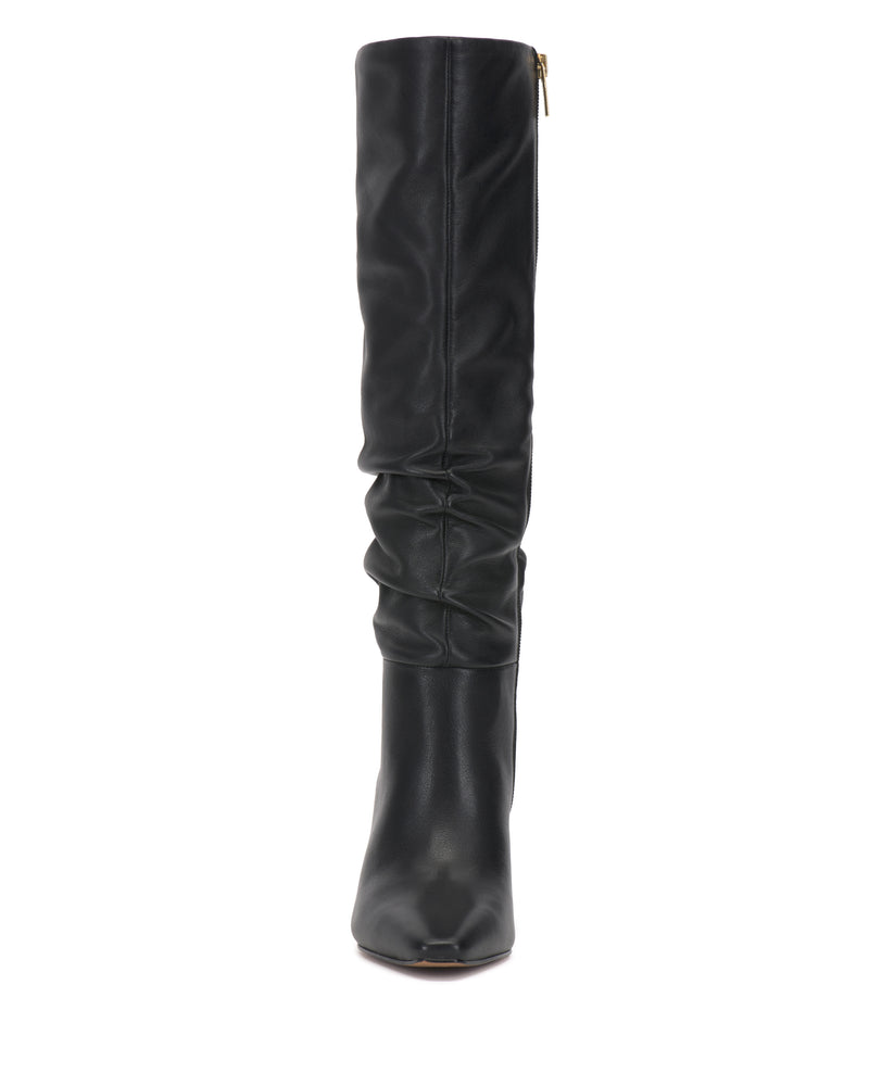 The Vince Camuto Genisa Narrow Calf Slouchy Knee High Boot is a tall black leather boot featuring a slightly slouchy shaft, a side zipper, and a rounded toe, shown standing upright and facing forward against a white background.
