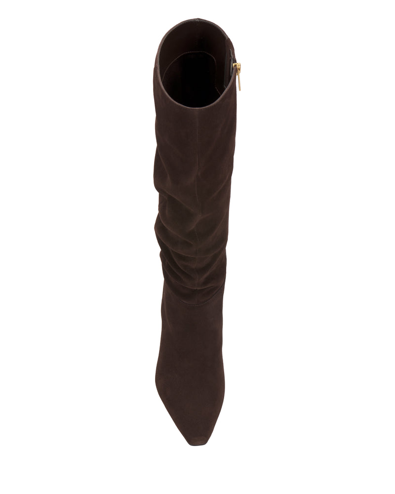 A top view of the Genisa Wide Calf Slouchy Knee High Boot by Vince Camuto, featuring dark brown suede, a pointed toe, and a slightly slouched shaft, displayed on a white background.