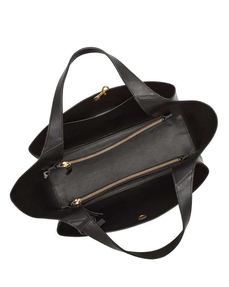 Top view of the Vince Camuto Gilda Tote Bag, an open black leather tote featuring a central zippered compartment, visible gold zippers, and two shoulder straps. The interior and hardware details are clearly displayed.