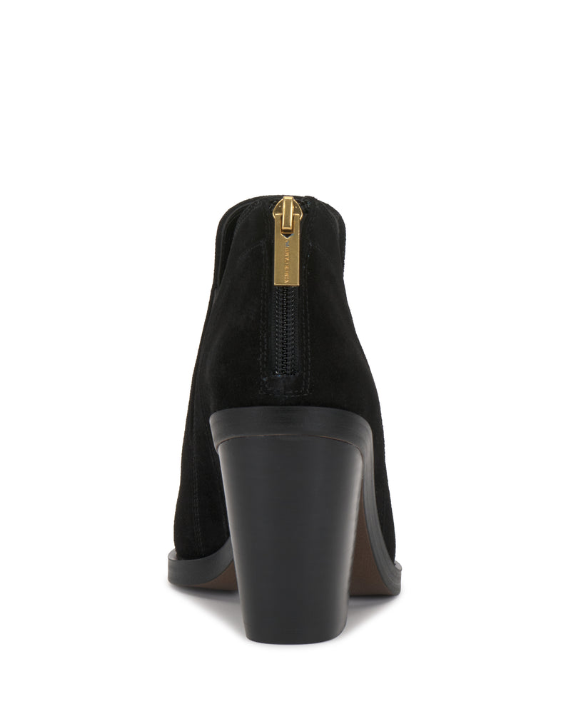The Gradina Bootie by Vince Camuto is a black suede ankle boot with a chunky high heel, shown from the back. It features a gold zipper pull and a smooth sole.