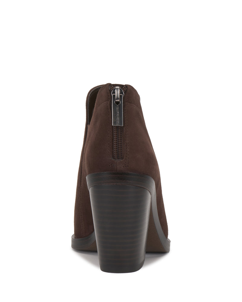 The Vince Camuto Gradina Bootie, featuring brown suede, a chunky stacked heel, and a visible back zipper, is shown from the rear against a white background.